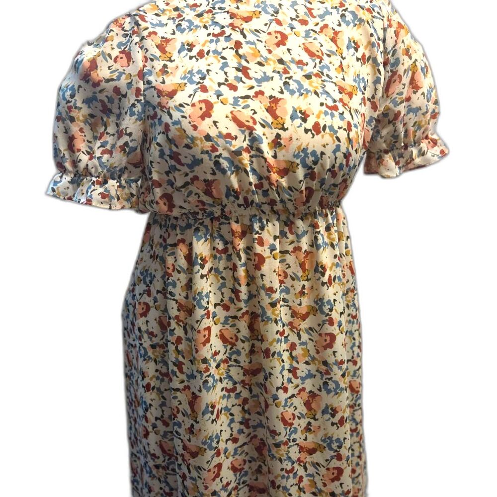 Hayden Smock Neck Long Dress in a colorful cream floral pattern
